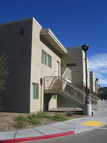 an apartment building with stairs and a stair case