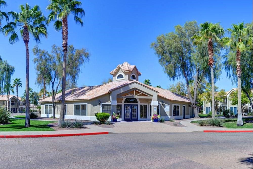 a building with palm trees in front of it