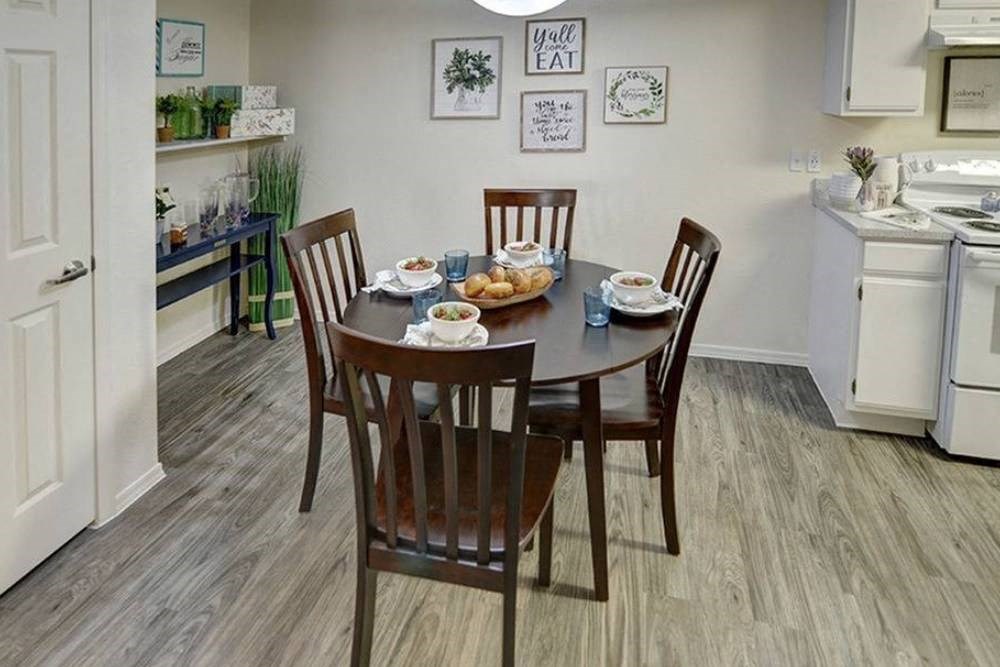 a dining room with a table and chairs