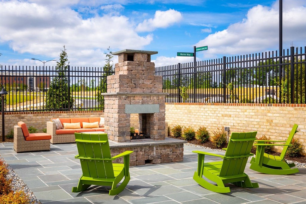 Outdoor lounge with firepit and chairs