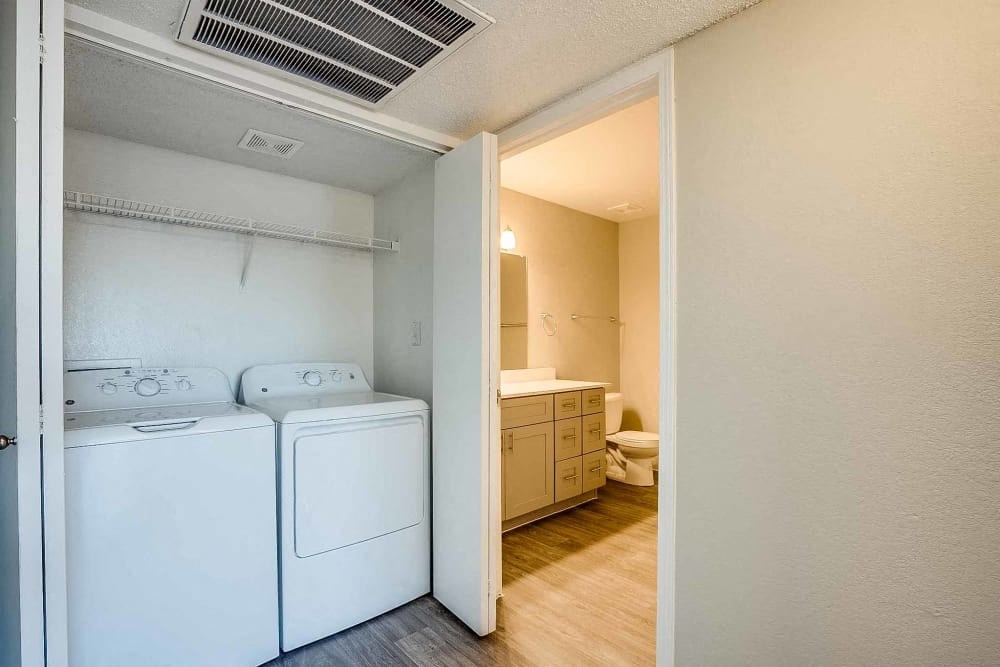 a washer and dryer in a room with a bathroom