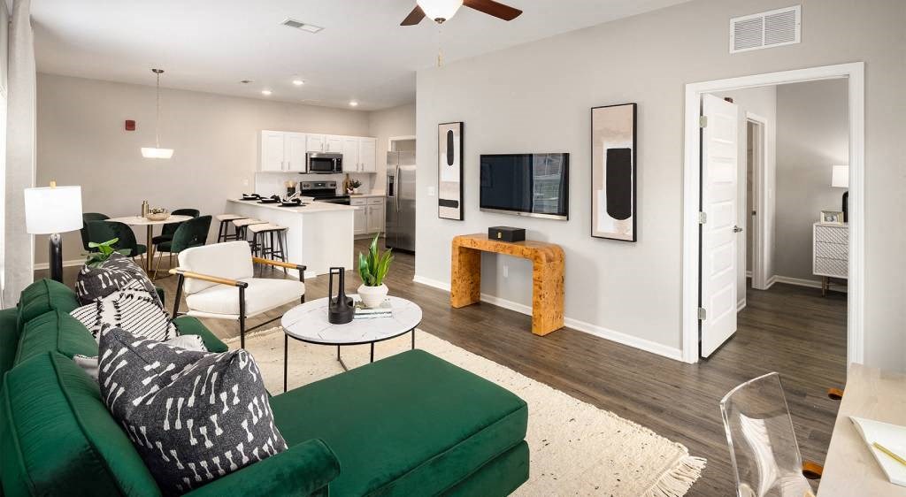 Living Room with green couch and tv