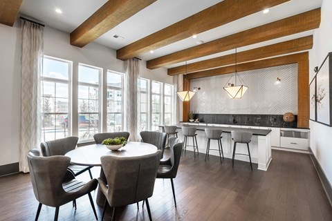 Resident lounge and clubhouse area with tables and chairs