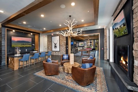 A modern living room with a fireplace and a large painting on the wall.