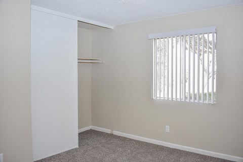 A room with a window and a door.