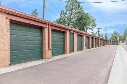 A long row of garage doors are closed.