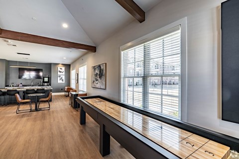 A modern kitchen with a dining table and chairs.