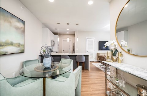 Apartment dining room with table and chairs
