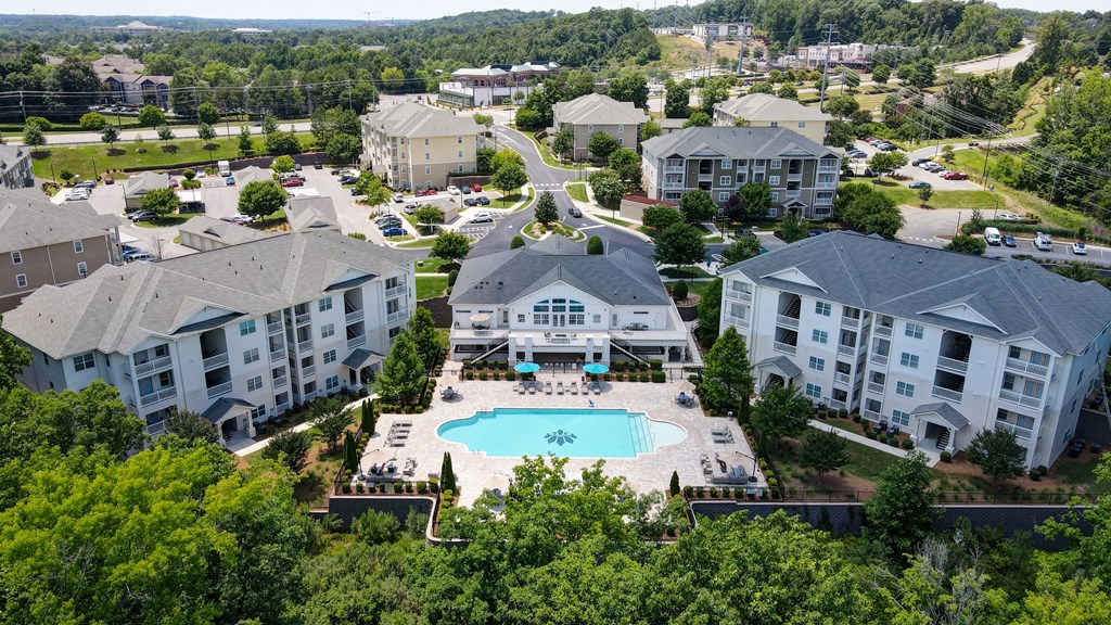 aerial view of apartment buildings, leasing office, and pool
