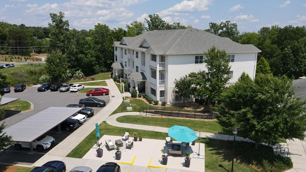 community lounge area with umbrellas and chairs