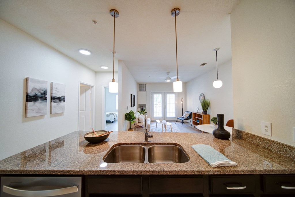 apartment kitchen with granite countertops and stainless steel applicances