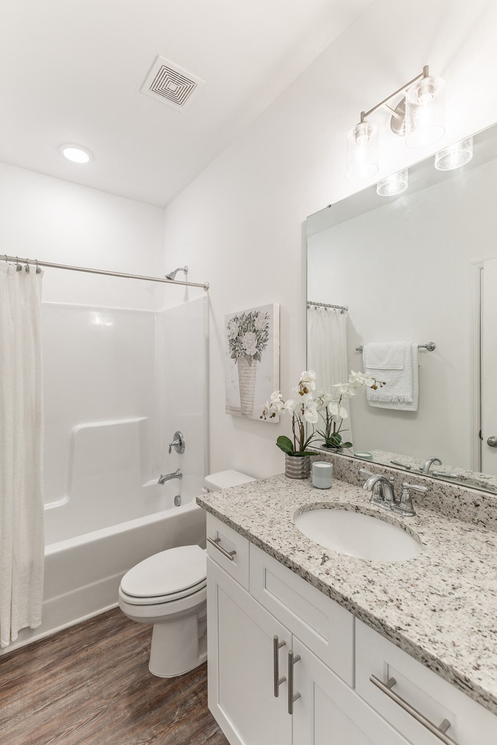 a bathroom with a toilet sink and bathtub