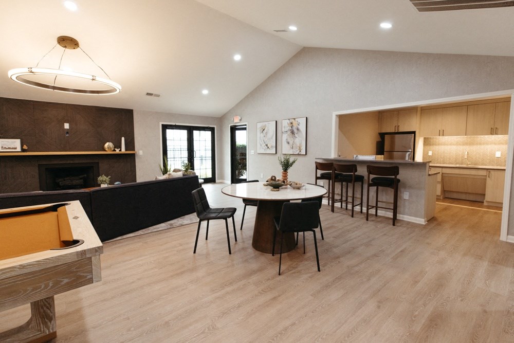 a large living room with a dining area and a kitchen