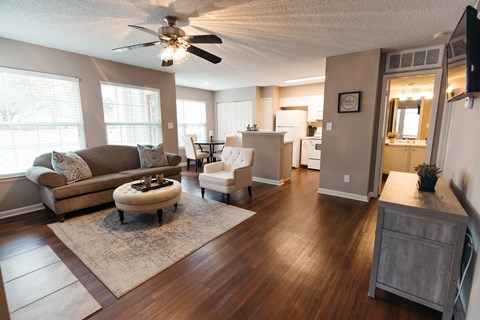 the view of the living room from the kitchen and dining room