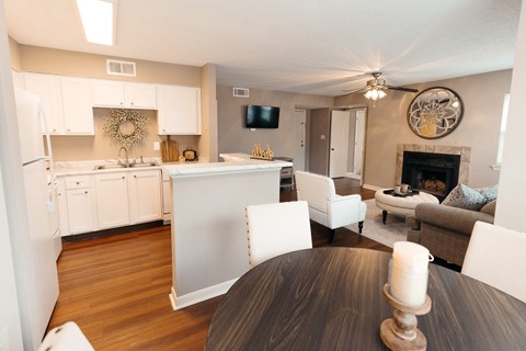 A modern kitchen with a dining table and chairs.
