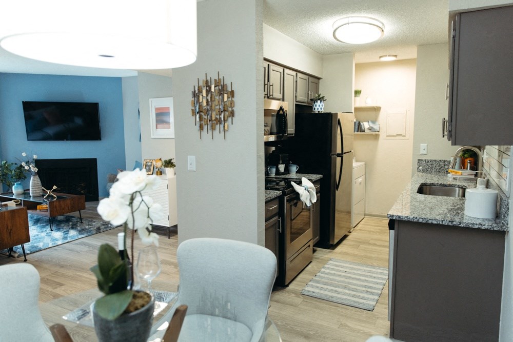 a view of the kitchen and living room from the dining room
