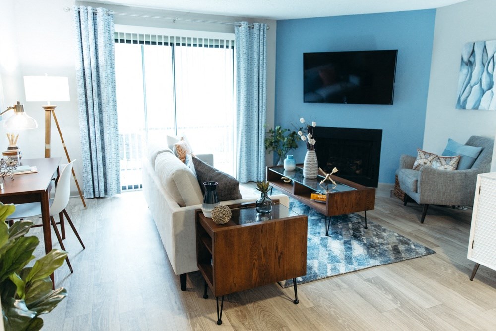 a living room with a couch and a table and a television