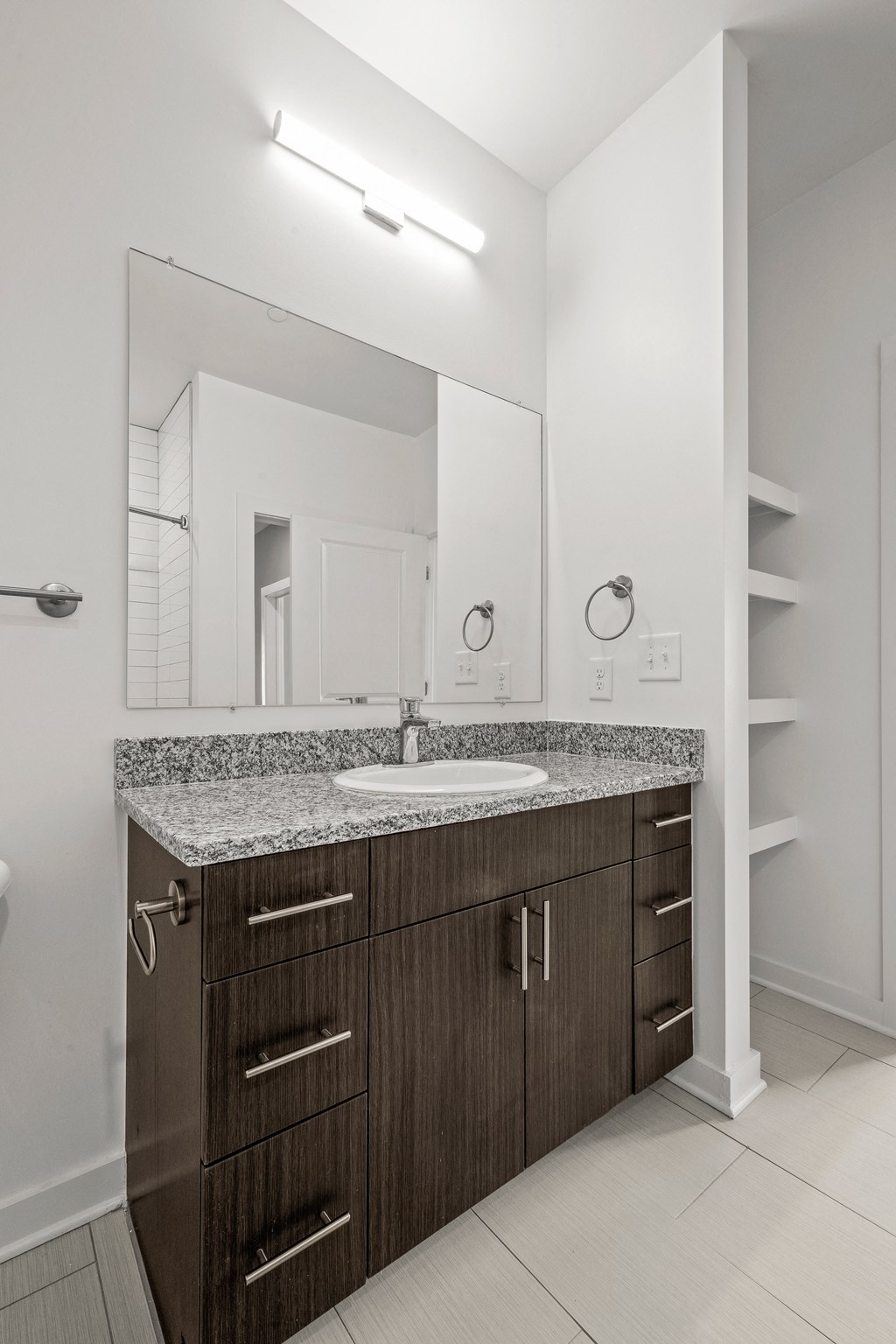 a bathroom with a sink and mirror