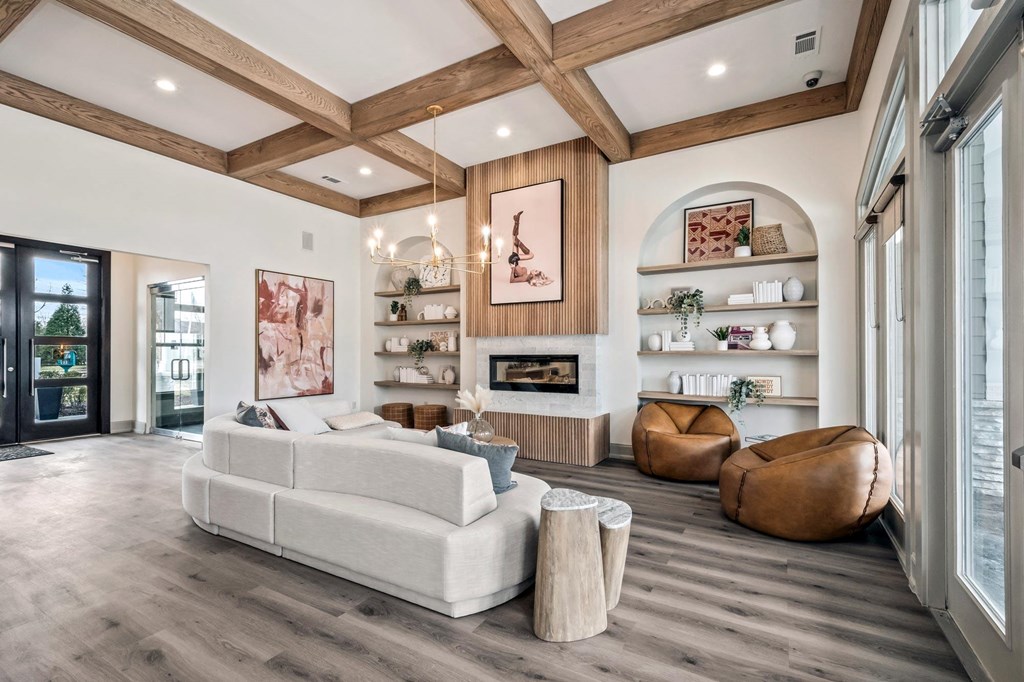 a living room with a white couch and a fireplace