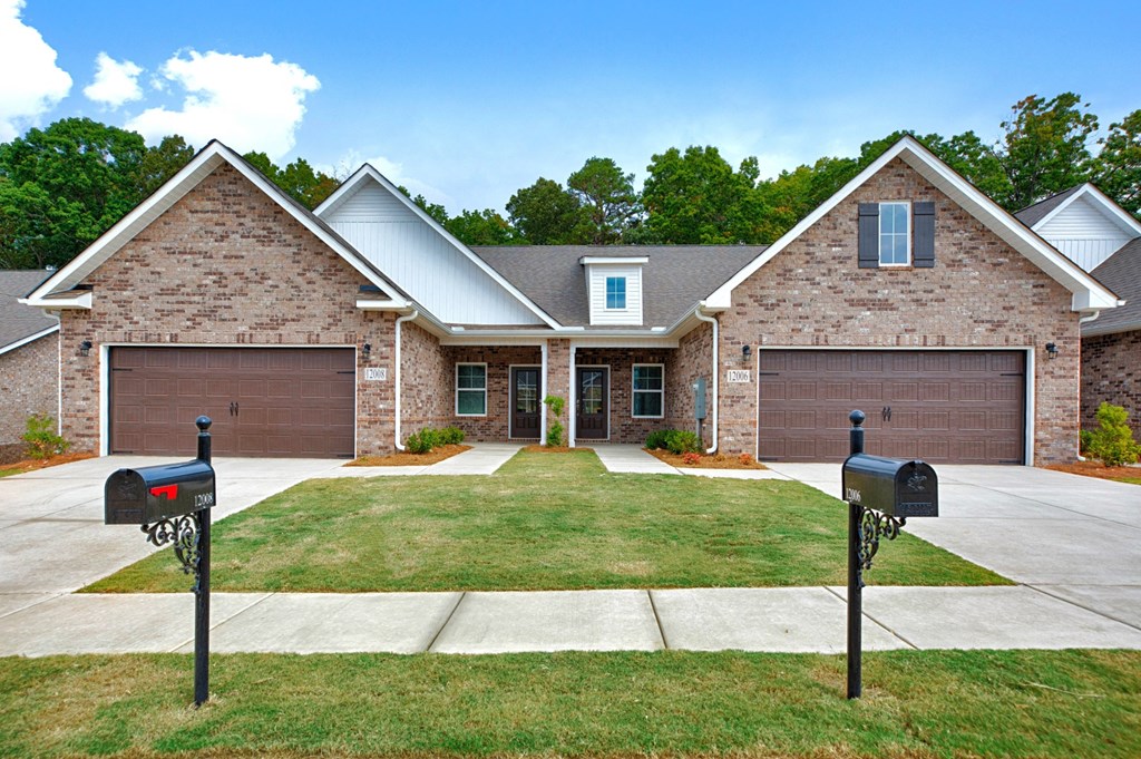 a house with two parking meters in front of it
