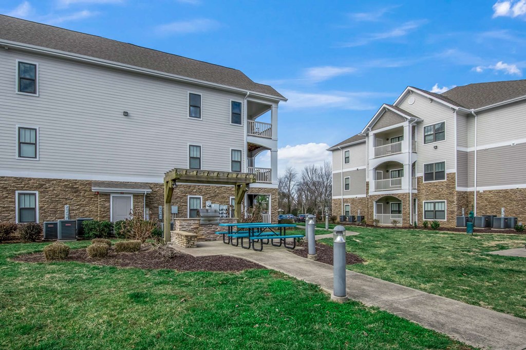 our apartments feature a spacious courtyard with a picnic table