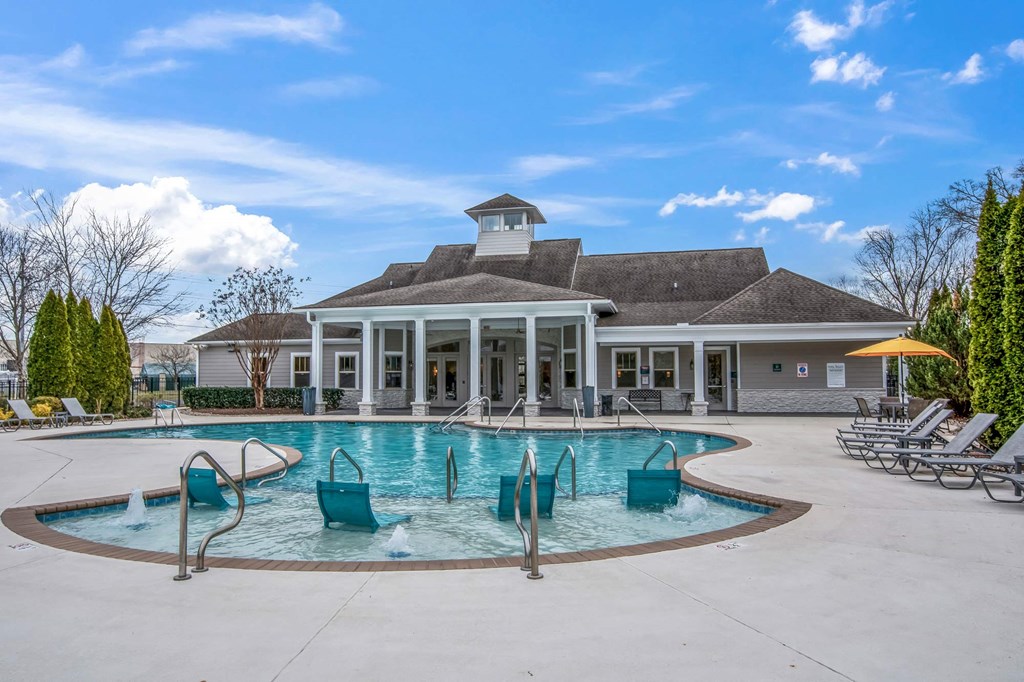 the swimming pool at the clubhouse at the estates apartments
