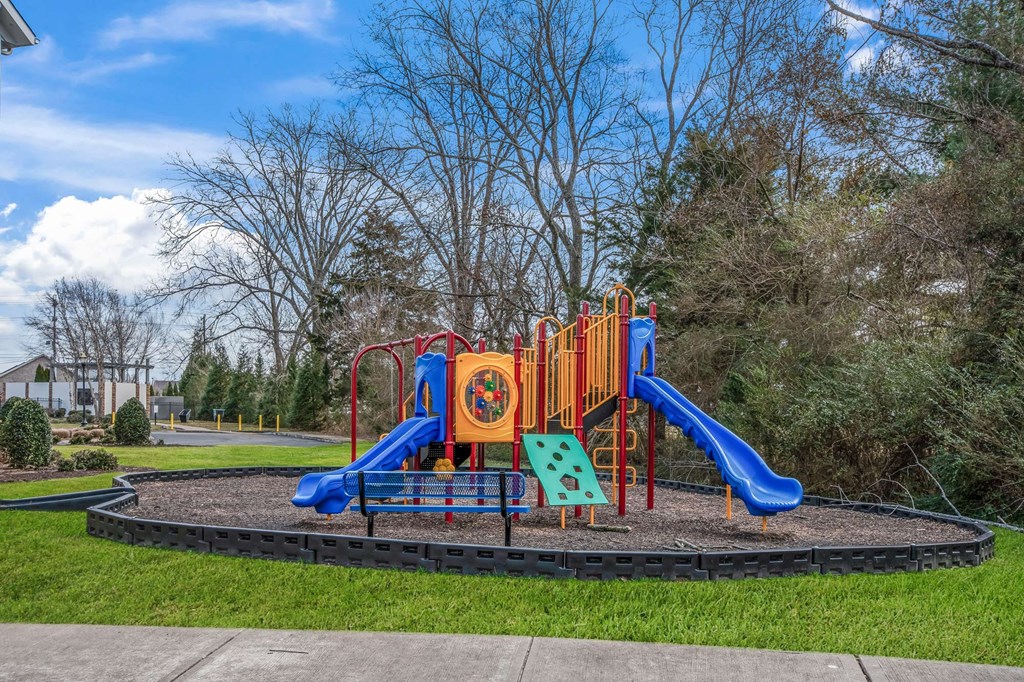 a playground in a park on a sunny day