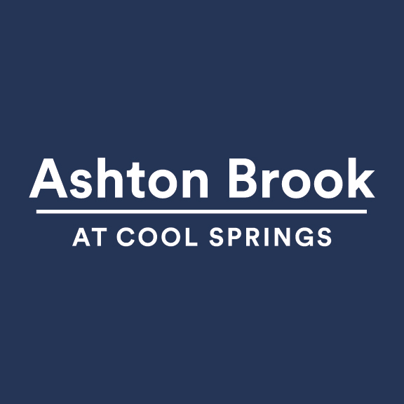 A blue background with the text "Ashton Brook at Cool Springs" written in white.