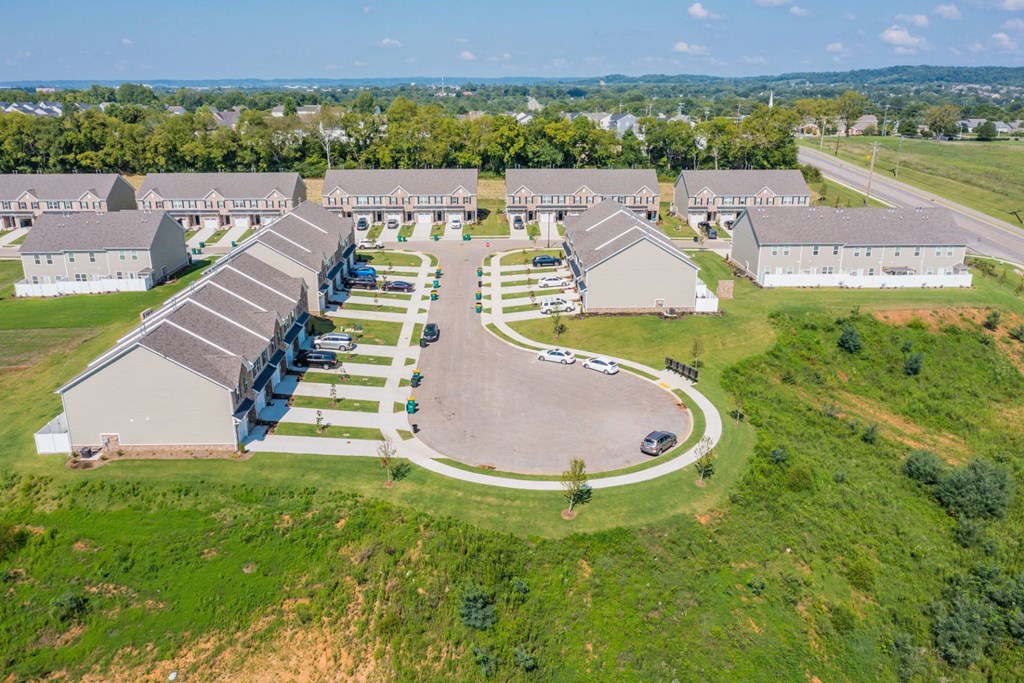 a group of houses in a field