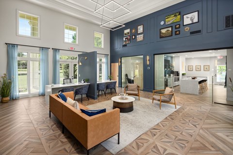 A living room with a large couch and a coffee table.