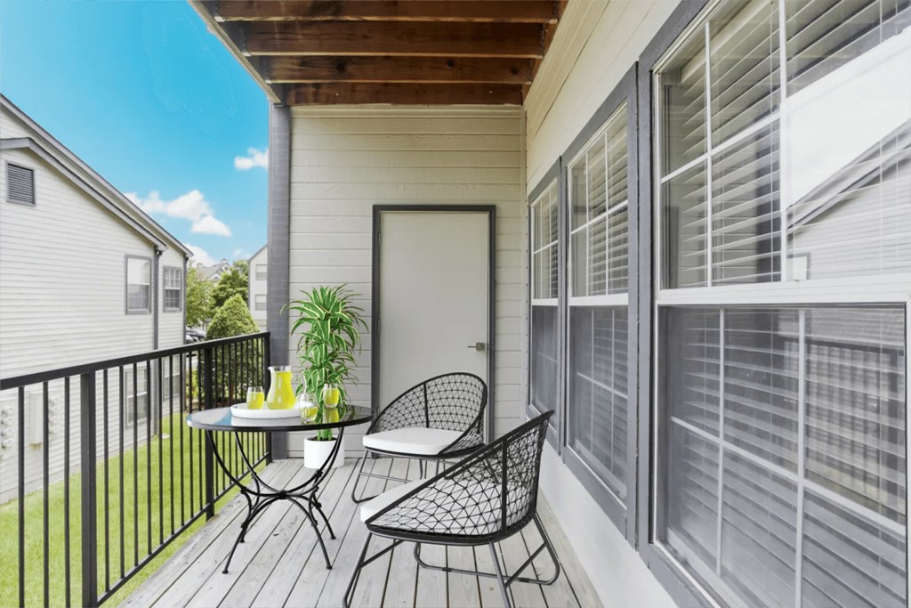 A patio with a table and chairs is shown.