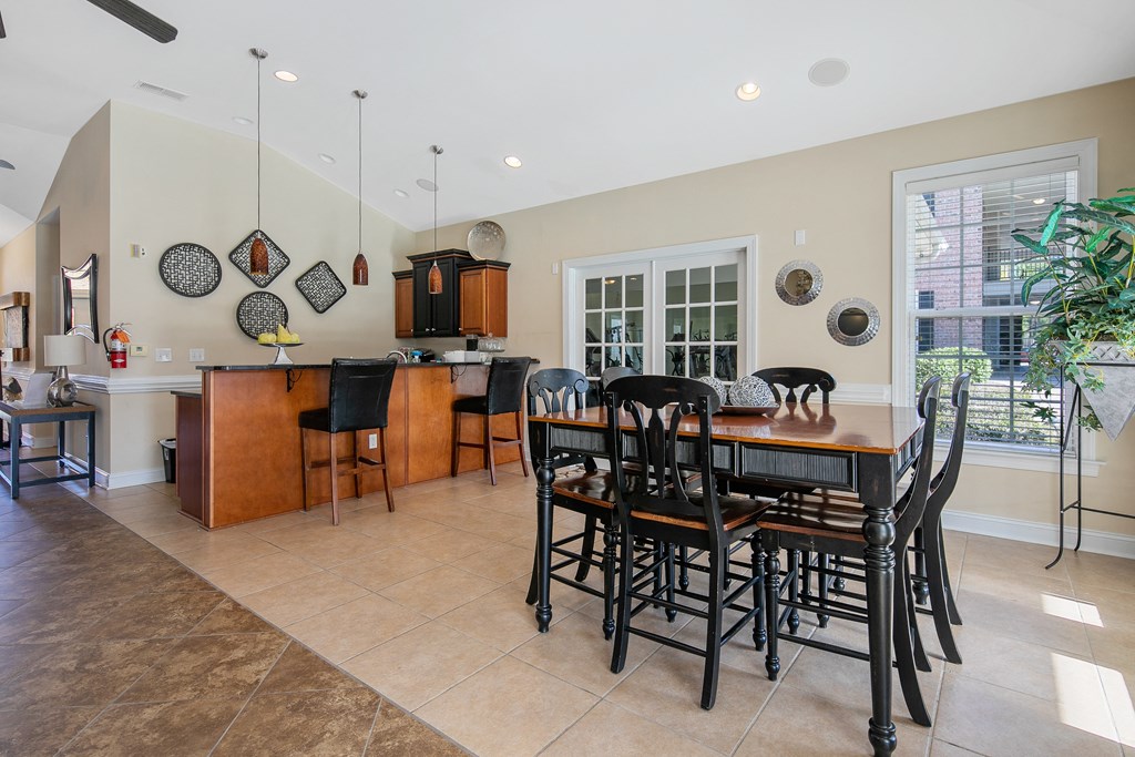 an open kitchen and dining room with a table and chairs