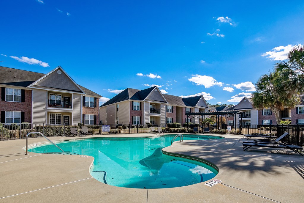 the preserve at ballantyne commons swimming pool with apartment buildings in the background