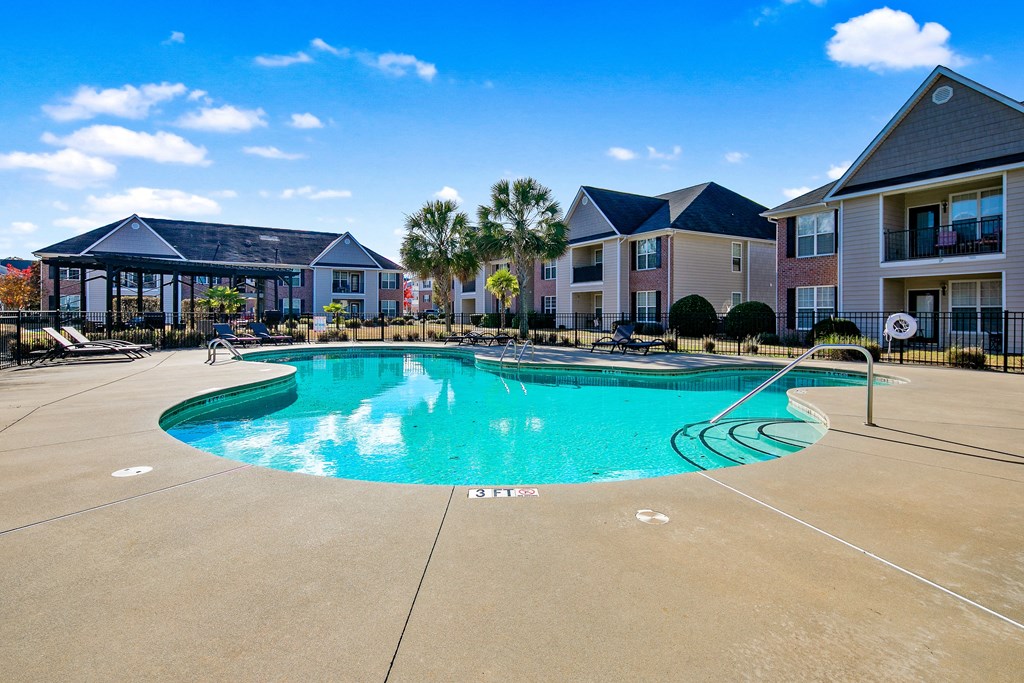 the preserve at ballantyne commons community swimming pool with apartment buildings