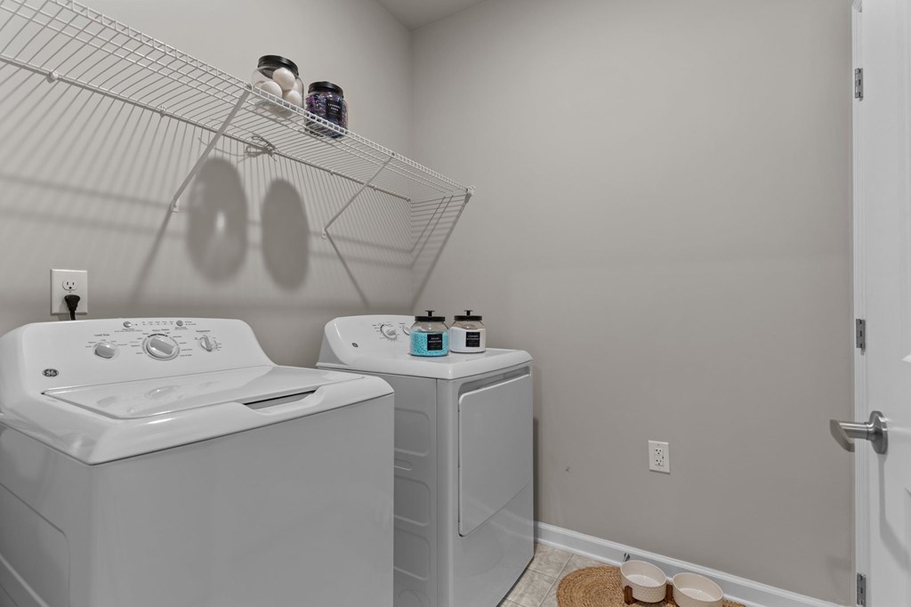 A laundry room with a washer and dryer.