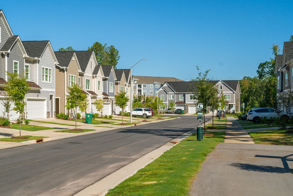 a row of houses on the side of a street