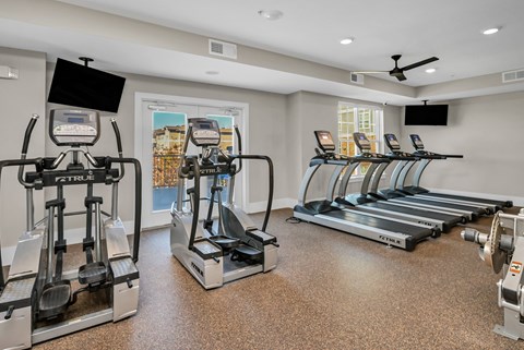 A gym with treadmills and elliptical machines.at Residence at Marina Bay, Irmo, SC 29063