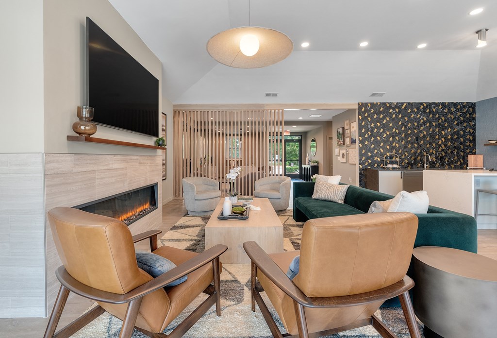 a living room with a fireplace and a tv
