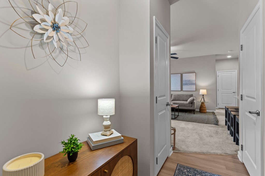 A room with a wooden table and a lamp on it.
