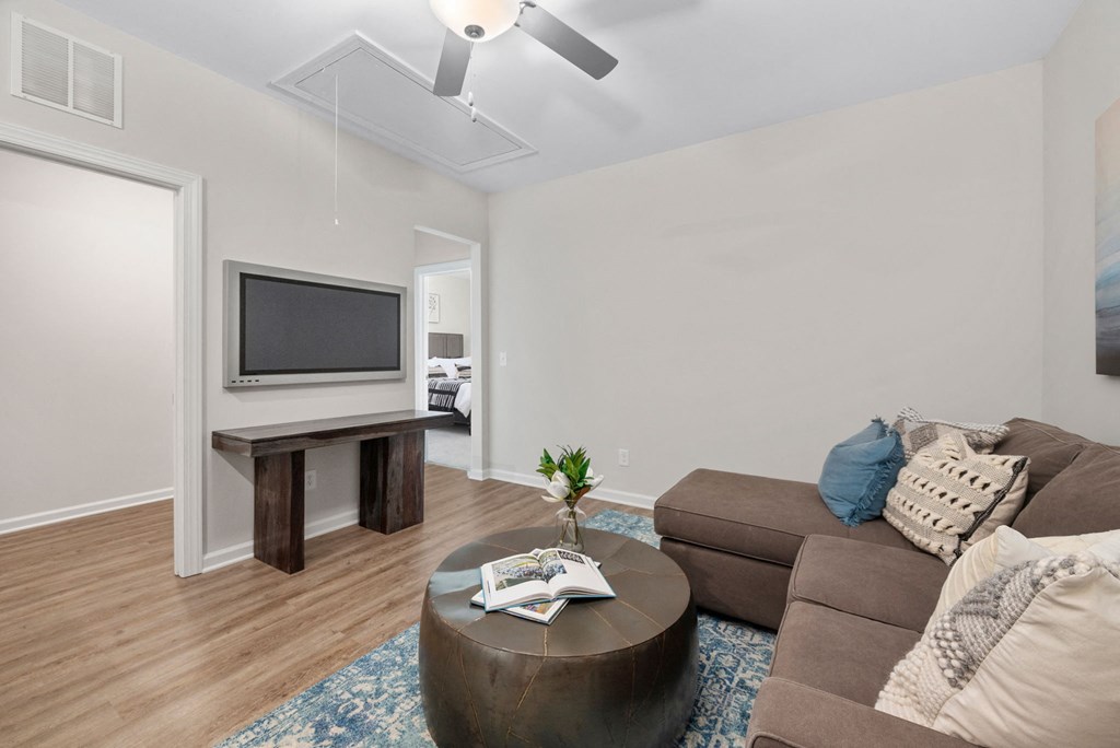 a living room with a couch and a tv