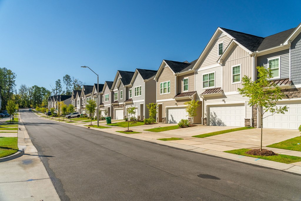 a row of houses on the side of a street