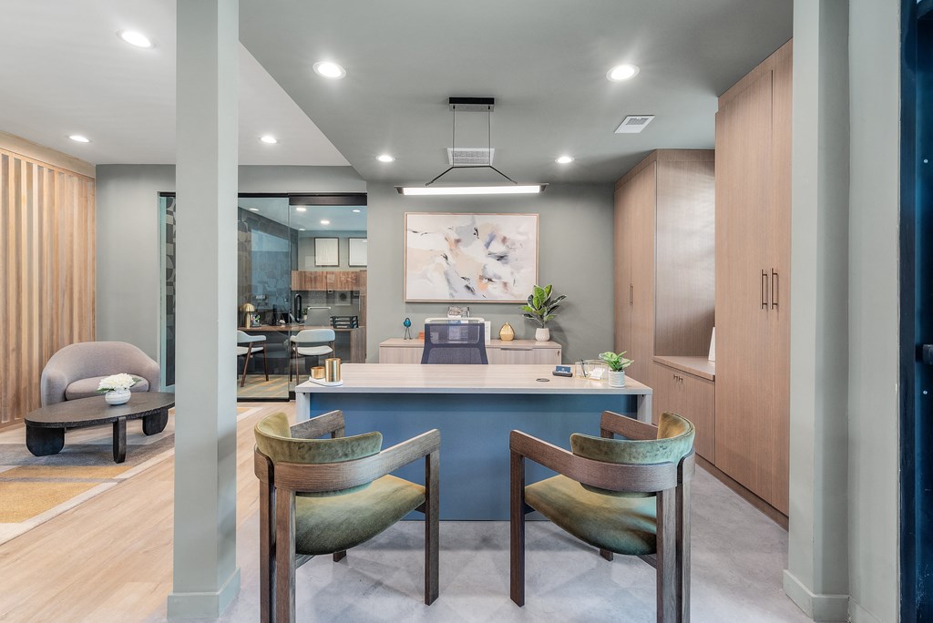 a dining room with a blue counter and chairs