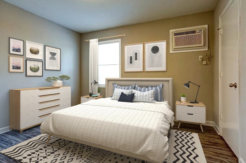 a bedroom with a bed and dresser in front of a window