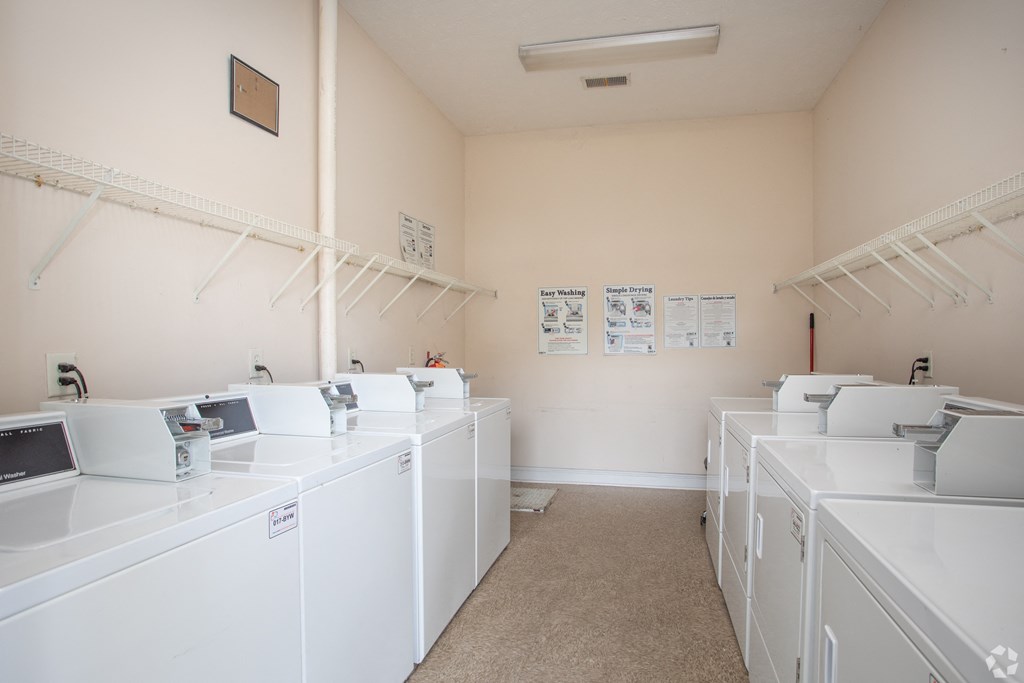 A laundromat with washers and dryers.