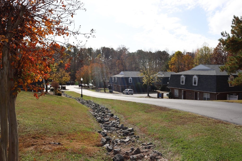 a view of a neighborhood with a road and houses