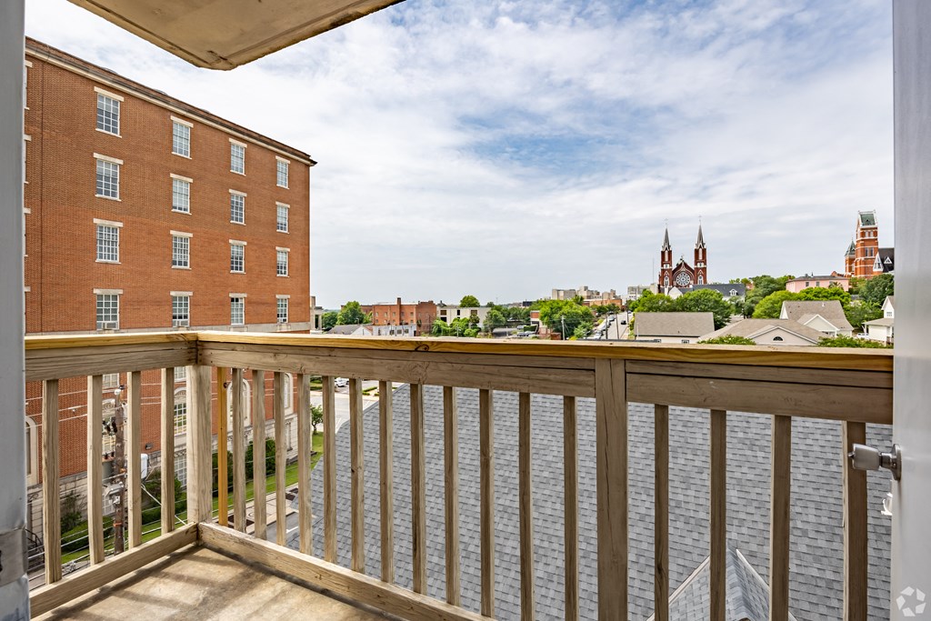 a balcony with a view of the city