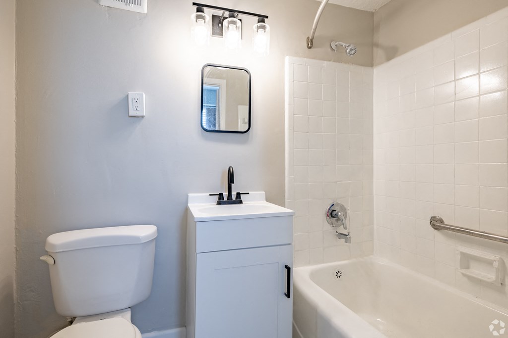 a bathroom with a toilet sink and bathtub