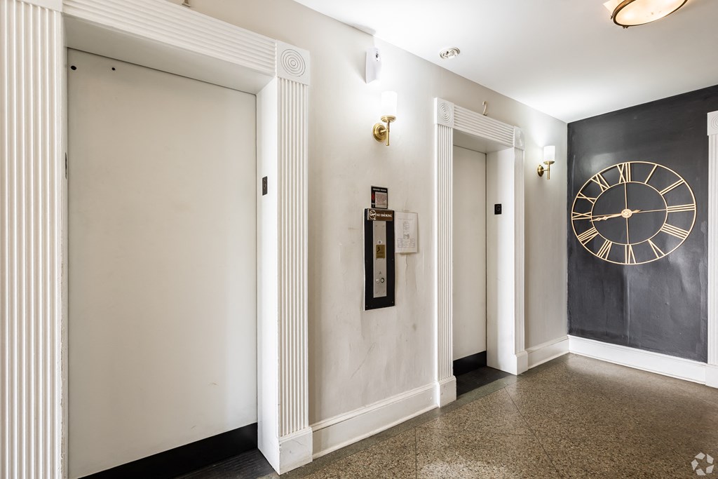 a view of a hallway with a clock on the wall