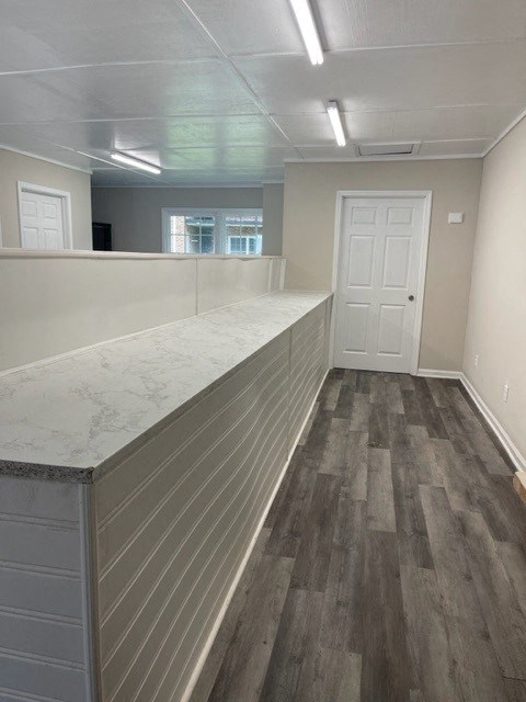 a kitchen with a counter top and a door