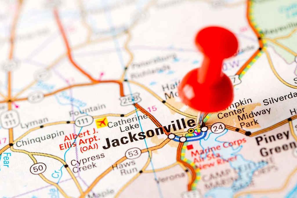 a red thumbtack on a map